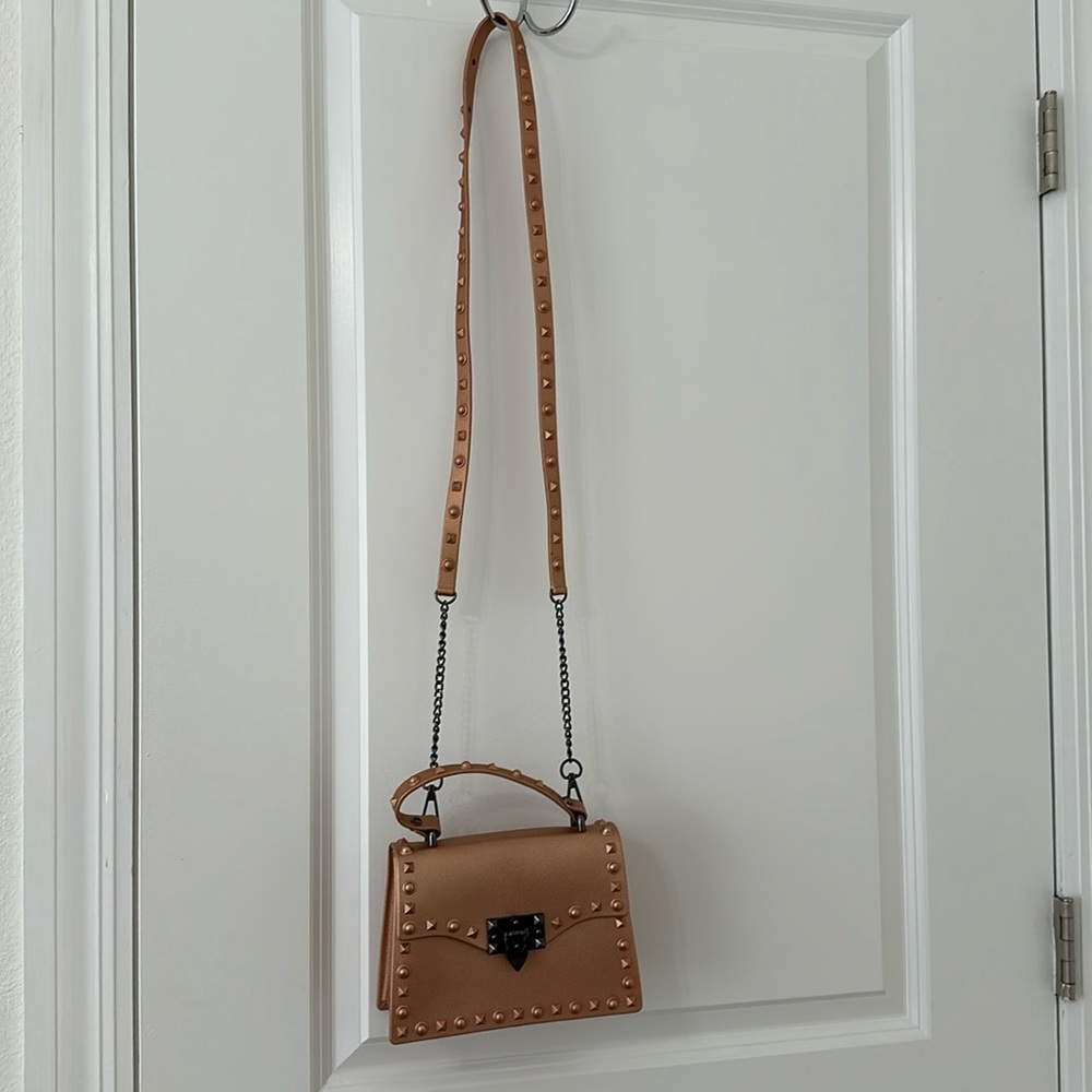 Rose gold purse with black chain